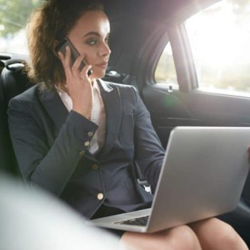 female-executive-travelling-to-work-in-luxury-car-768x512